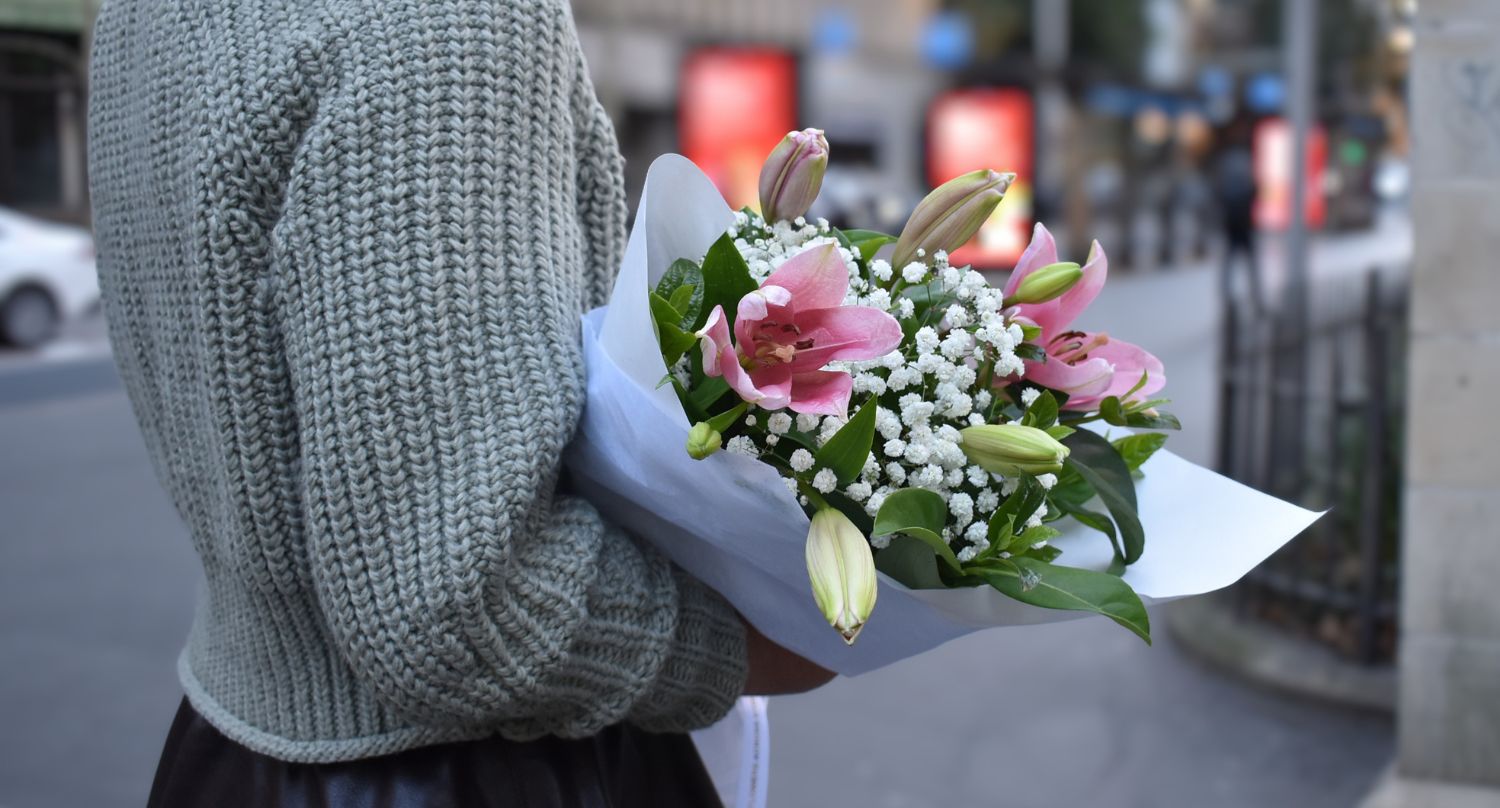 Woman holding bouquet of lilies