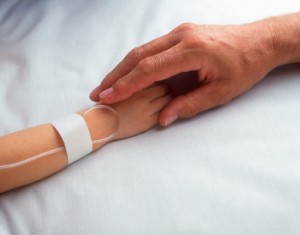 iStock_000000735381XSmall_two-hands-clasping-in-hospital-300x235