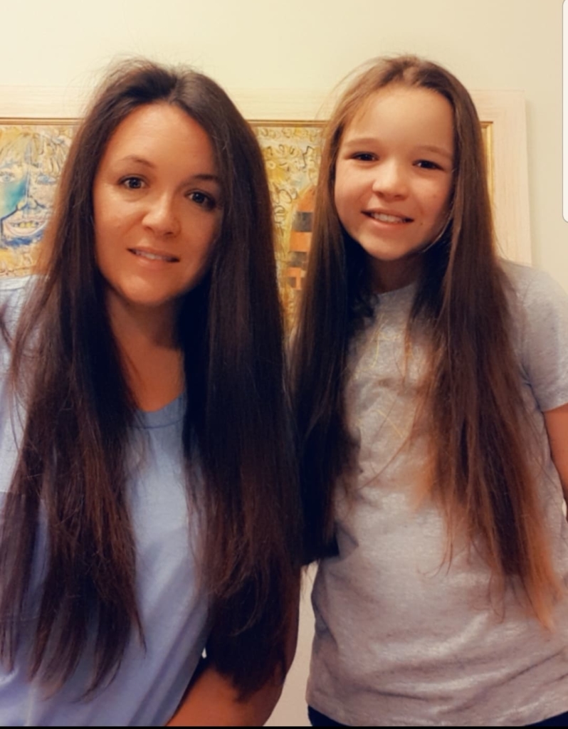 Jocelyn and Ella show their hair growth to donate to cancer research